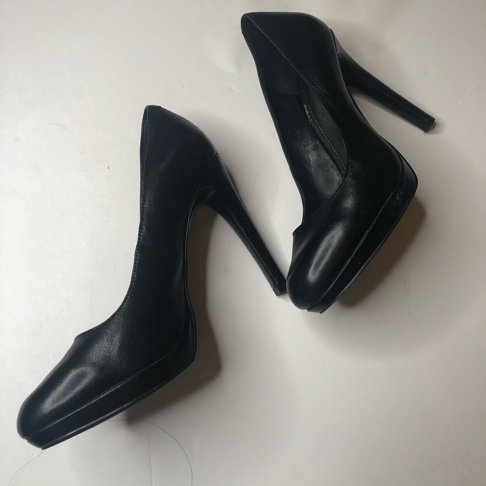 Black leather pumps